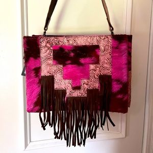 Brand new with tags, American darling pink hair on hide bag with pink strap.